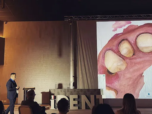 Dr. Timofte Costin lecturing at a dental conference